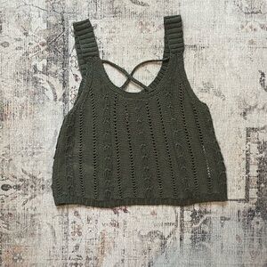 Green knit tank top with criss cross chest and a scoop neckline. #cropped #knit